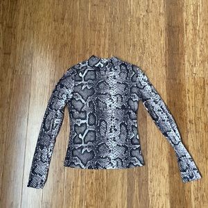 Snake print turtleneck semi sheer top